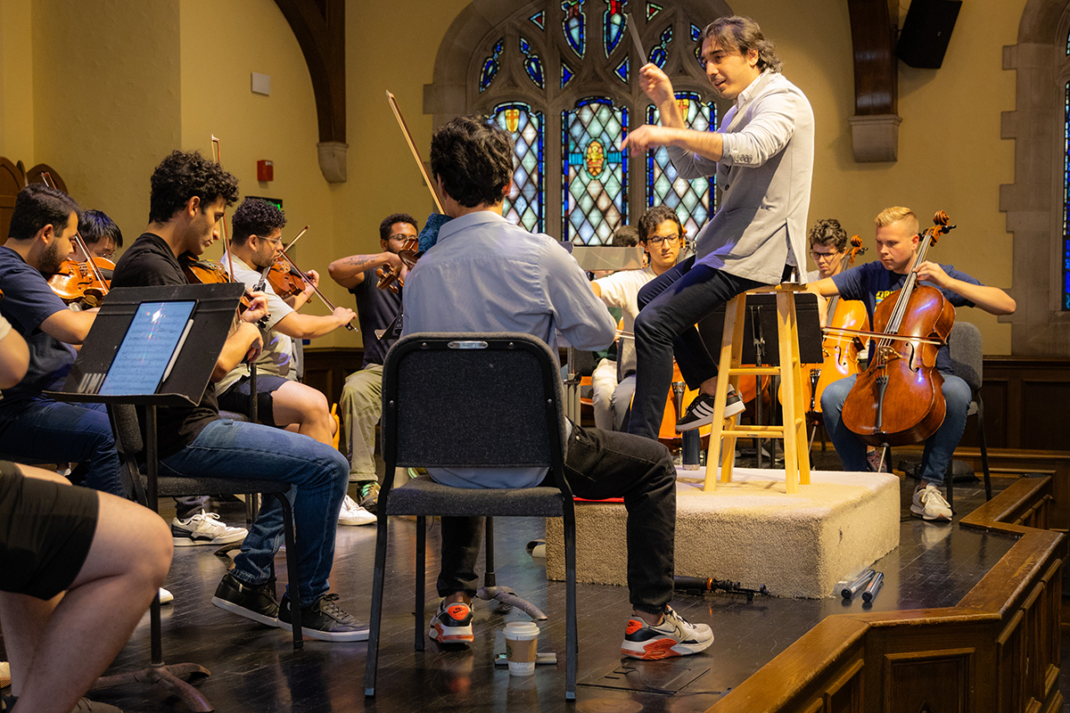 Park University string students rehearse with conductor Shah Sadikov